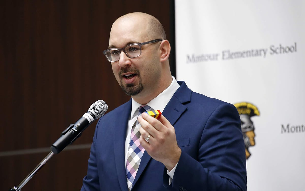 Justin Aglio, Montour’s director of academic achievement K-4 and district innovation, holds Legos as he speaks prior to the grand opening of the Brick Makerspace, a room filled with Legos and other building materials and equipment at the new Montour Elementary.