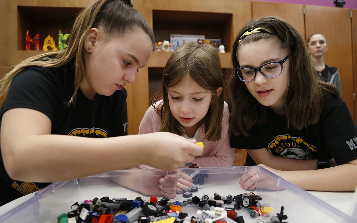 Inside the Brick Makerspace—a room filled with Legos and other building materials and equipment at Montour Elementary—students Joslin Heckathorne (left), Emma Mcmahon (center) and Brynn Kaczmarek build a car with Legos on Feb. 22, 2018.