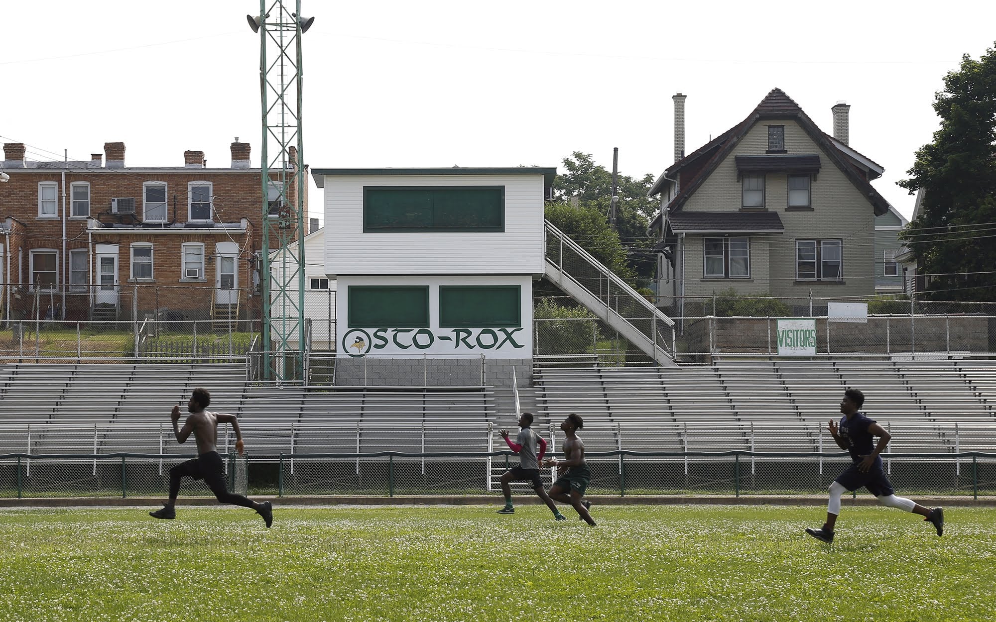 Members of the Sto-Rox football team run across the school's football field in June.