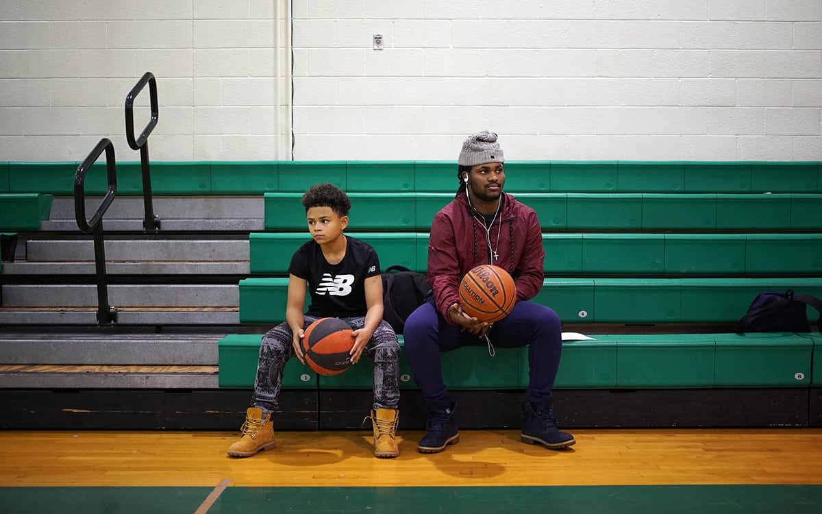 In December 2017, Sto-Rox Junior-Senior High School students Tyson Peterson (left) and Will Johnson watch as fellow students play basketball.