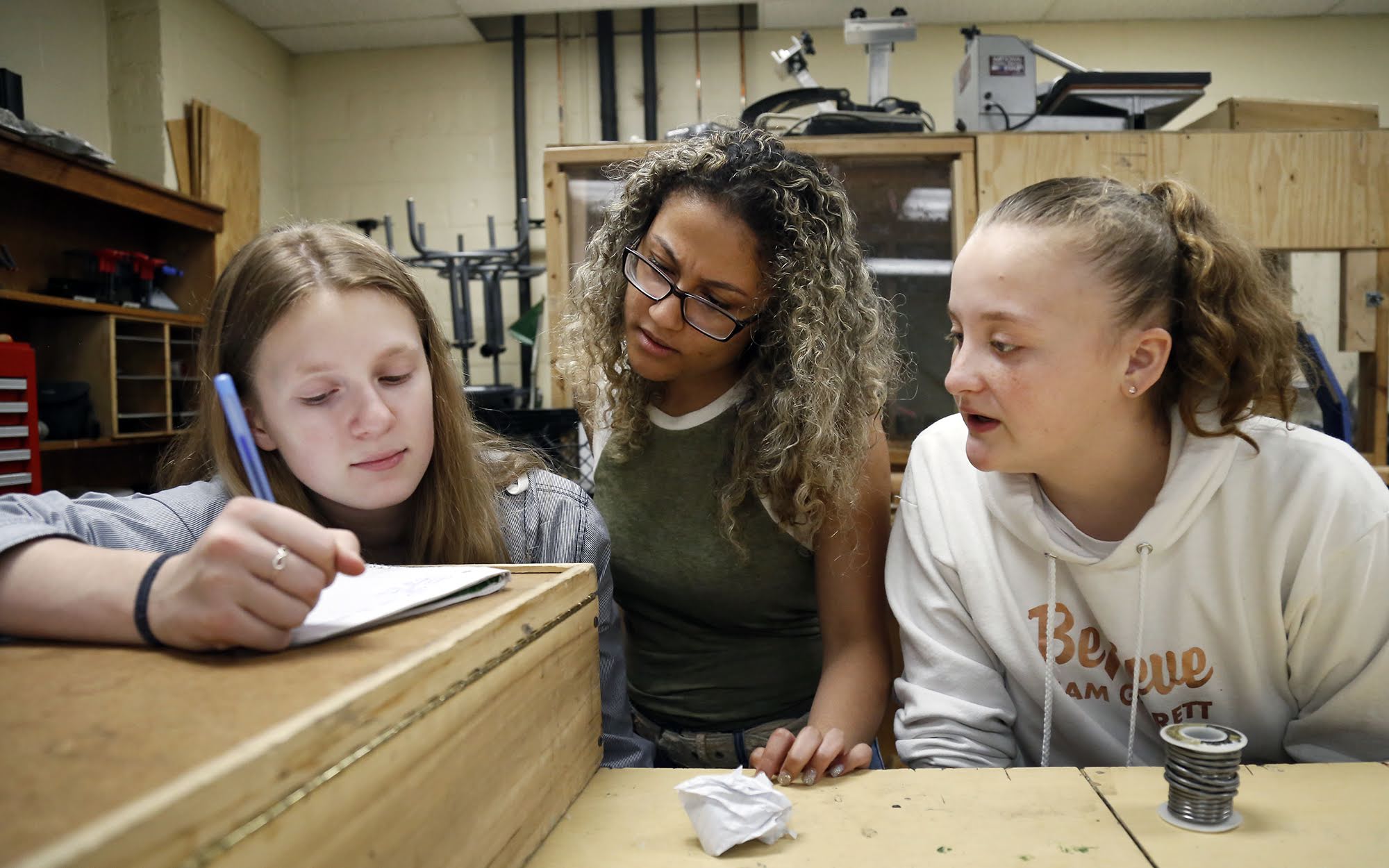 In May, Clairton Middle/High School student Lauren Weatherspoon (center) worked with classmates Abigail McGee (left) and Wendy Florenz (right) during a robotics class.