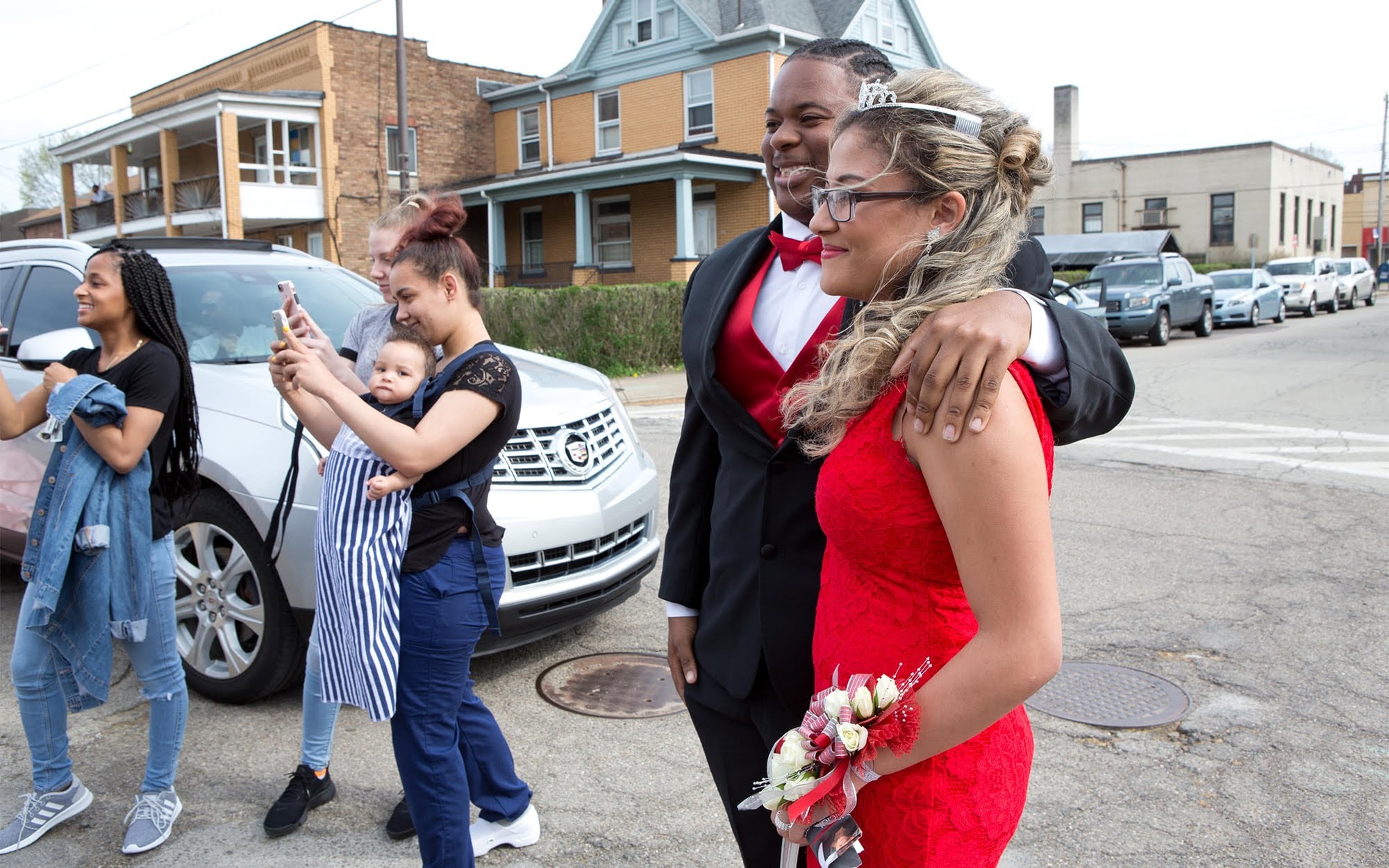 Lauren Weatherspoon and escort Duane Ringgold pose for photos in the school’s lobby after the Clairton promenade.