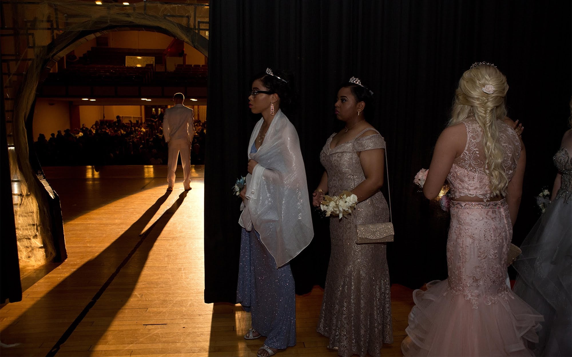 Candidates for prom queen await introduction backstage during the 2018 Clairton Promenade. (Photo by Heather Mull/PublicSource)