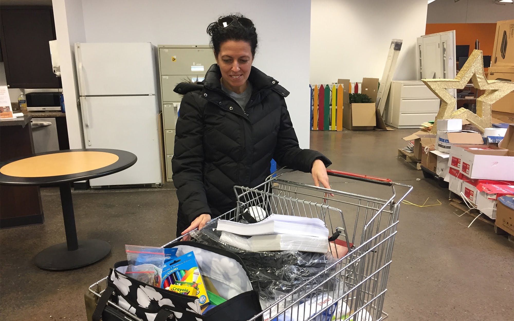 Sherri Koger, a second-grade teacher at Sto-Rox Primary Center, leaves The Education Partnership distribution on March 10 with a cart full of supplies for her students.